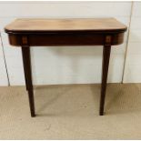 A George III style mahogany folding tea table (H73cm D42cm W84cm opened)
