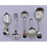 A selection of various silver spoons, with various hallmarks and makers.