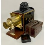 H Luscombe Toms magic lantern along with slides.