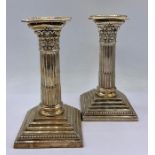 A pair of silver column themed Mappin & Webb candlesticks, hallmarked.15cm H