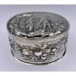 A Dutch silver lidded repousse decorated lidded pot.