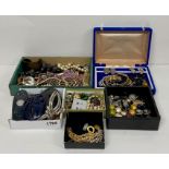 A substantial box of costume jewellery to include necklaces, hair clips, earrings, necklaces etc