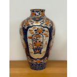 A Substantial 18th Century / 19th Century Imari vase with extensive repairs.