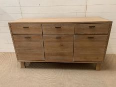 A contemporary lime oak sideboard by Hudson Living (H80cm W140cm D49cm)