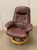 A leather easy armchair in oxblood