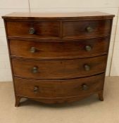 A bow front chest of drawers, two over three long (H108cm W108cm D56cm)