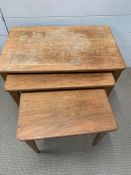 A nest of three teak tables by Gordon Russell