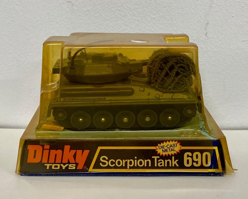 A boxed Dinky 690 Scorpion tank with shells and camouflage nets