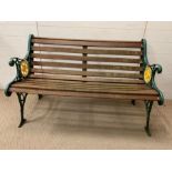 A garden bench with metal ends and wooden slats (One slat broken) (H78cm W124cm D64cm)