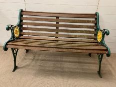 A garden bench with metal ends and wooden slats (One slat broken) (H78cm W124cm D64cm)