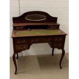 A mahogany writing desk with a mirrored back, glass ink well and green leather top AF (H105cm