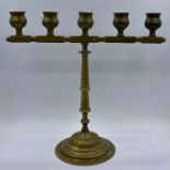 A Five light Iranian brass candlestick