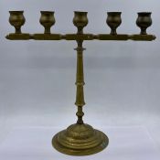 A Five light Iranian brass candlestick
