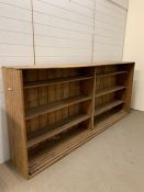 An antique pine open shelving unit (H118cm W252cm D39cm)