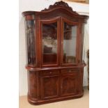 A glazed display cabinet with scrolled details to edges and double doors to base (H230cm W150cm