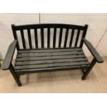 A wooden garden two seater bench (H87cm W131cm D63cm)