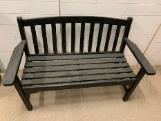 A wooden garden two seater bench (H87cm W131cm D63cm)