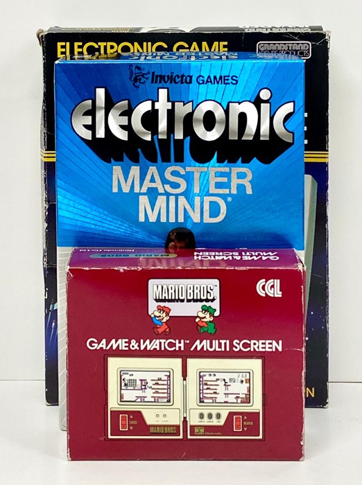 Three Vintage electronic games to include: Nintendo Game & Watch Mario Bros with original box and