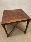 A small square mahogany side table with cross stretches (40cm x 40cm x 40cm)