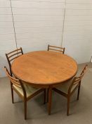 A G-Plan extendable table and four chairs