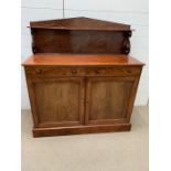 A mahogany sideboard with rear upstand (H117cm W107cm D46cm)