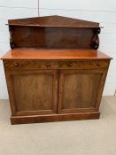 A mahogany sideboard with rear upstand (H117cm W107cm D46cm)