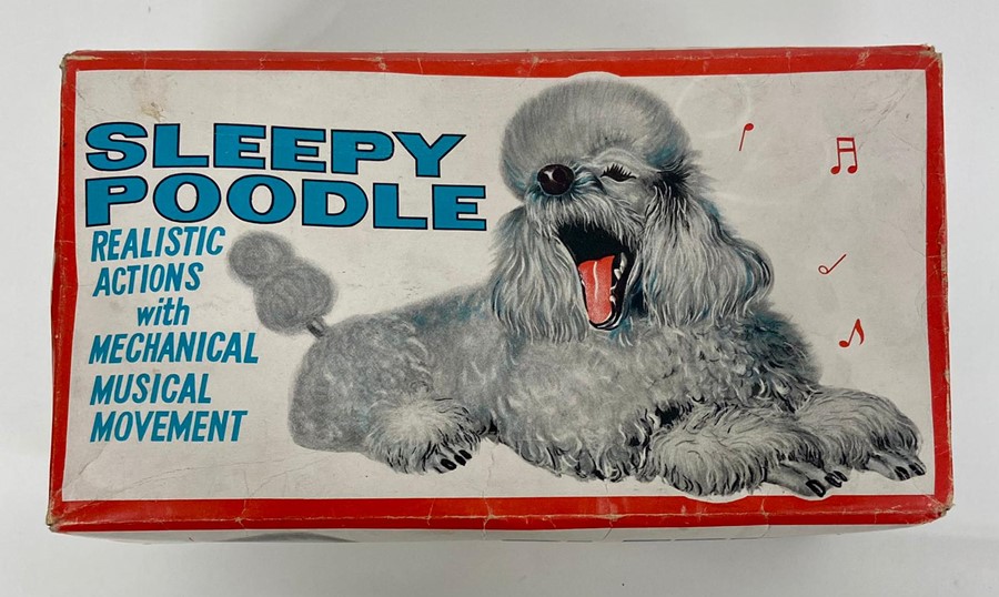 A vintage Alps Sleepy Poodle toy, realistic actions with mechanical musical movement