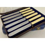 Two boxed sets of butter knives