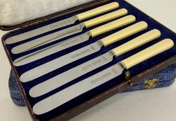 Two boxed sets of butter knives
