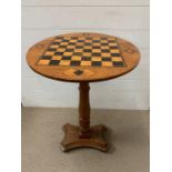 An inlaid games table (H74cm Dia48cm)