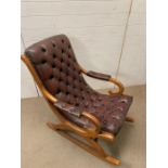 A button back leather rocking chair