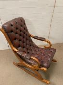 A button back leather rocking chair