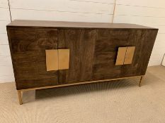 A contemporary sideboard on brushed brass legs and handles by Mercury Row (H76cm W148cm D44cm)