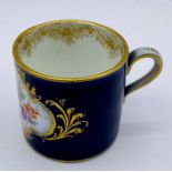 A Meissen miniature coffee cup, hand painted.