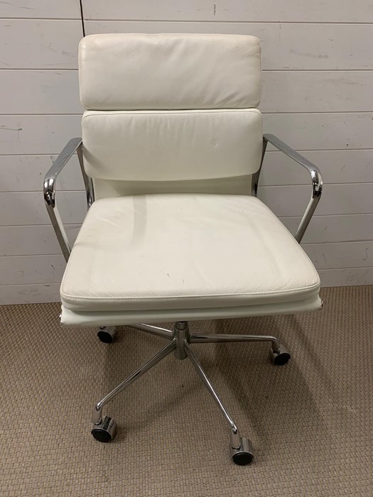 A Mid Century faux leather office chair on chrome legs