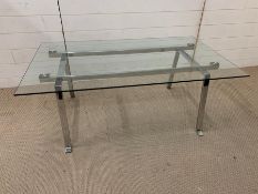 A glass and chrome coffee table (H46cm W120cm 72cm)