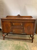 A mahogany sideboard with carved details to doors (H110cm W137cm D48cm)