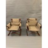 A pair of Mid Century metal directors style chairs with wooden arm rests and back with original seat