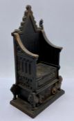 A 1953 cast iron throne moneybox