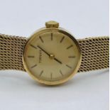 A Ladies Tissot watch on a 9ct gold, hallmarked strap total weight is (32.6g)