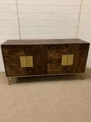 A contemporary sideboard on brushed brass legs and handles by Mercury Row (H76cm W148cm D44cm)