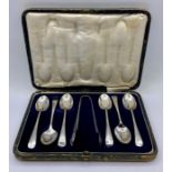 A 1935 cased silver teaspoon and sugar nip set by P Bros.