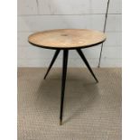 A Mid Century style table on tapered tri legs
