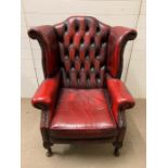 A oxblood wing back Chesterfield library chair