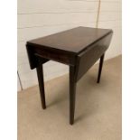 A mahogany drop-side side table (H72cm W84cm D44cm)