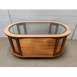 A Mid Century teak glass top coffee table on castors (H40cm W90cm D50cm)