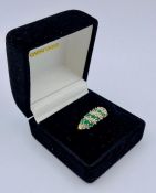 A 9ct gold diamond and emerald style ring (2.7g)