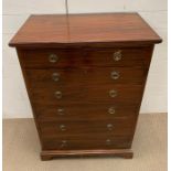 A mahogany tall chest of drawers with brass ring handles and bracket feet (H99cm W69cm D40cm)