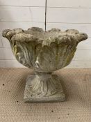 A garden planter with leaf design to side on stand (H46cm Dia47cm)