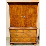 A Queen Anne style walnut fitted cabinet on chest. Escritoire with a pair of doors, opening to